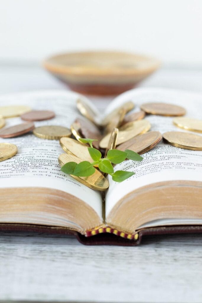 Powerful prayer for financial favor and abundance with open Bible and golden Christian background